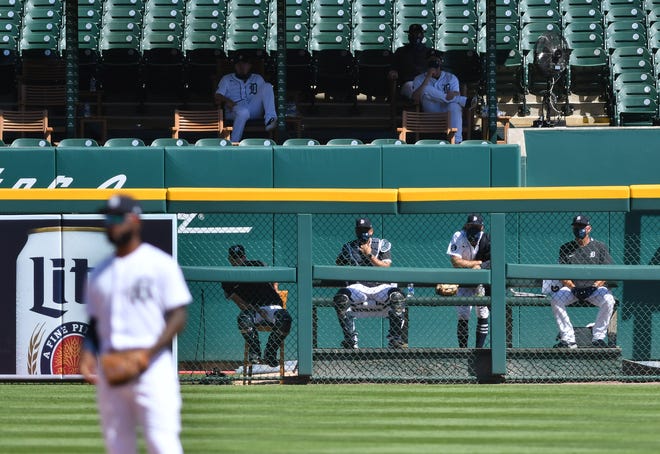 Tigers pitchers and staff in the bullpen and the bullpen overflow in the eighth inning.