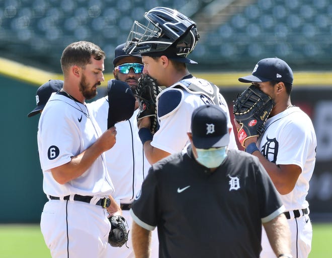 From left, Tigers pitcher John Schreiber, Niko Goodrum, Grayson Greiner and Jeimer Candelario talk before Schreiber takes over on the mound in the fifth inning.  Detroit Tigers vs Chicago White Sox at Comerica Park in Detroit on Aug. 12, 2020.