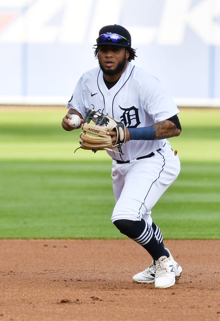 Tigers third baseman Dawel Lugo looks to home before making a throw in the first inning.