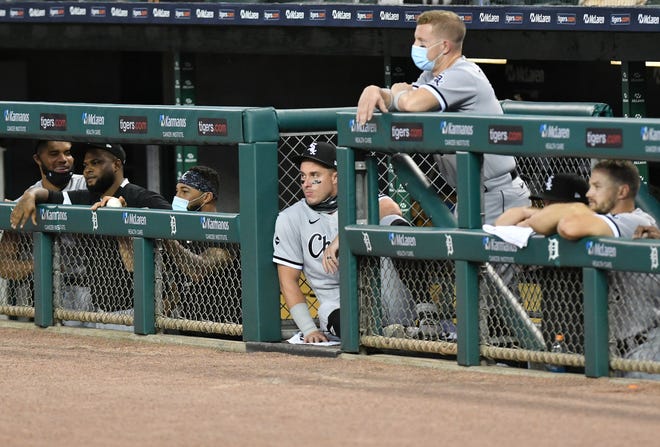 Former Tiger and now White Sox catcher James McCann, center, watches in the sixth in the inning.  Detroit Tigers vs Chicago White Sox at Comerica Park in Detroit on Aug. 11, 2020.