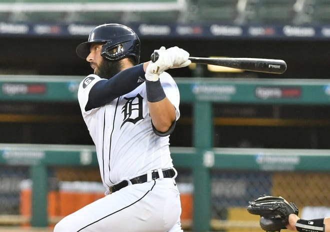 Tigers' Austin Romine hits a two-run home run in the fifth inning.