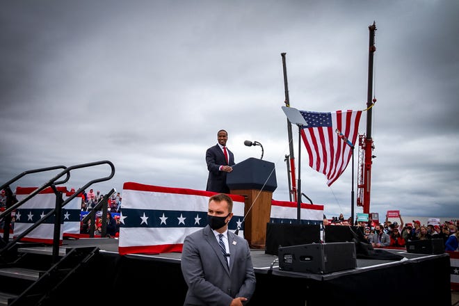 John James, US Senate candidate, gives a speech prior to the start of the rally. President Donald Trump makes a campaign stop at an airplane hangar in Freeland, Michigan on Thursday, September 10, 2020.