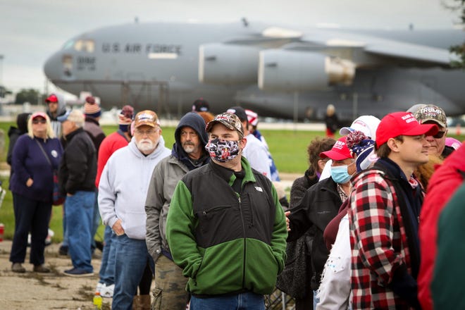 A queue forms in the morning to get inside a rally for a Donald Trump. President Donald Trump makes a campaign stop at an airplane hangar in Freeland, Michigan on Thursday, September 10, 2020.