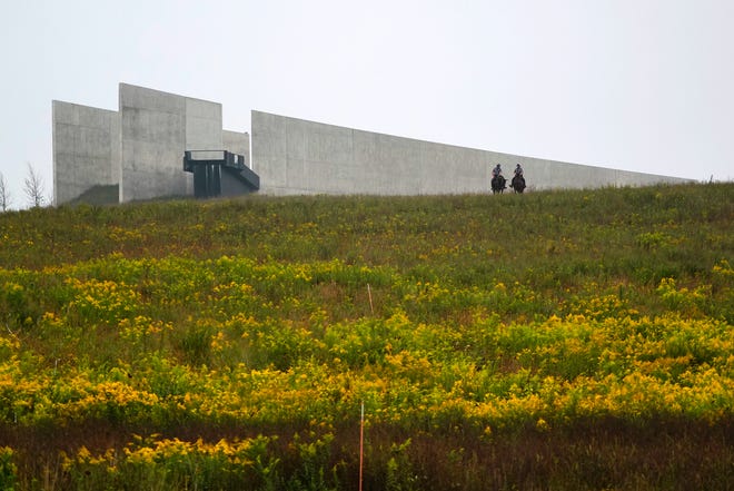 Mounted police officers sit outside the Visitor's Center at the Flight 93 National Memorial before a memorial service attended by President Donald Trump in Shanksville, Pa., Friday, Sept. 11, 2020.