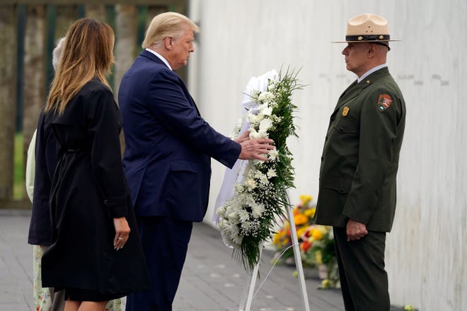 President Donald Trump lays a wreath at a 19th anniversary observance of the Sept. 11 terror attacks, at the Flight 93 National Memorial in Shanksville, Pa., Friday, Sept. 11, 2020.