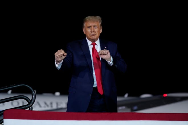 President Donald Trump gestures during a campaign rally at MBS International Airport, Thursday, Sept. 10, 2020, in Freeland, Mich.