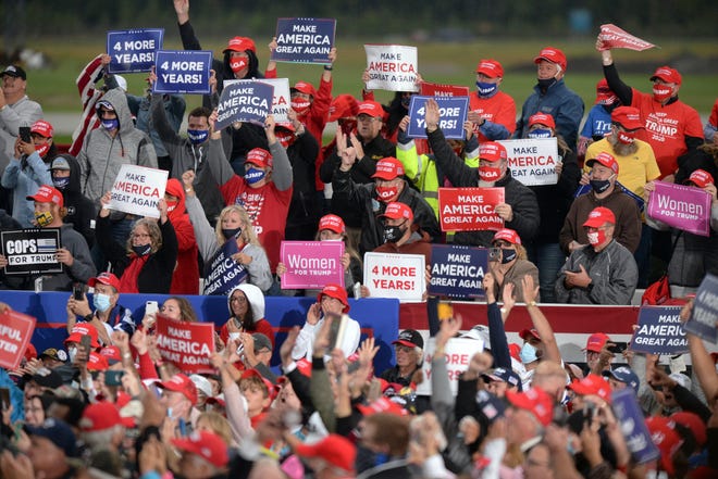 Supporters of President Donald Trump cheer during a campaign rally at MBS International Airport, Thursday, Sept. 10, 2020, in Freeland, Mich.