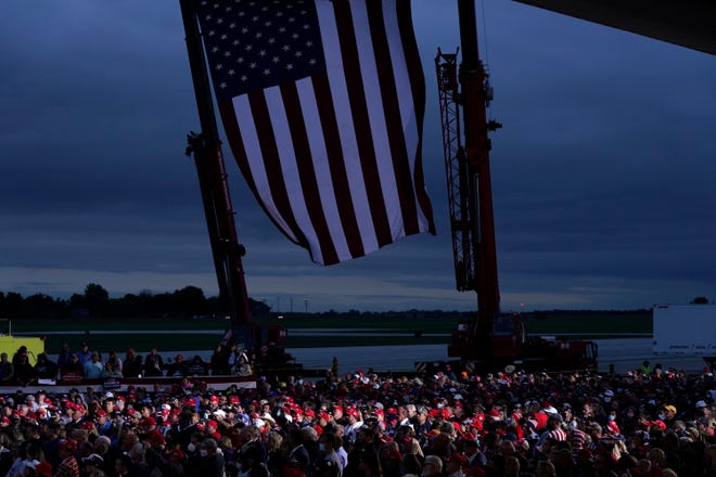 Supporters of President Donald Trump listen as he speaks during a campaign rally at MBS International Airport, Thursday, Sept. 10, 2020, in Freeland, Mich.