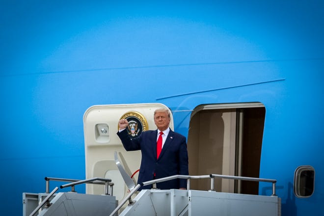 President Trump emerges from Air Force One in Michigan. President Donald Trump makes a campaign stop at an airplane hangar in Freeland, Michigan on Thursday, September 10, 2020.