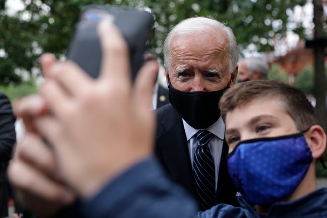 Democratic presidential candidate former Vice President Joe Biden poses for a photo as he attends the 19th anniversary ceremony in observance of the Sept. 11 terrorist attacks at the National September 11 Memorial & Museum in New York, on Friday, Sept. 11, 2020.