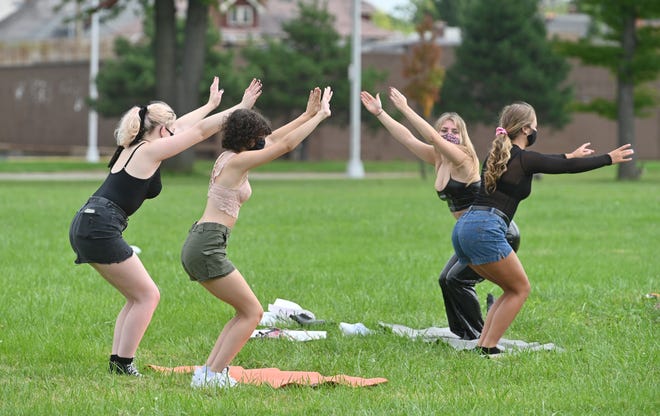 Participants get a free lesson in RustaYoga during the 2020 Detroit Slutwalk held at Palmer Park on Saturday.