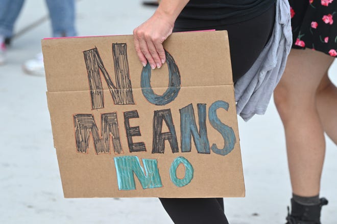 A participant carries a sign reading No Means No during the 2020 Detroit Slutwalk held at Palmer Park on Saturday, September 12, 2020.