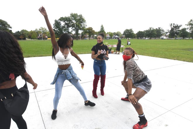 Participants dance during the 2020  Detroit Slutwalk held at Palmer Park on Saturday, September 12, 2020.
