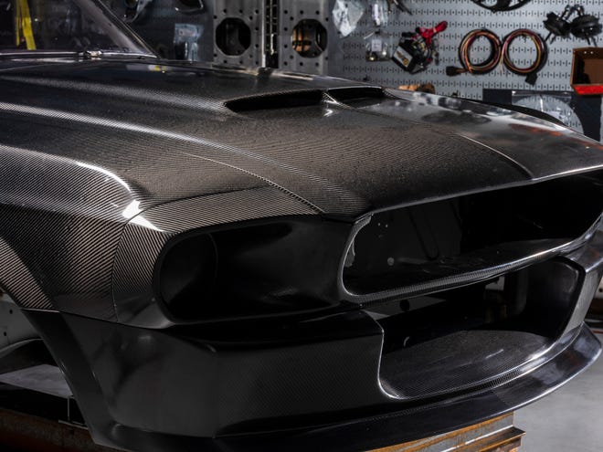 The carbon fiber body removes 600 lbs from the stock version of the muscle car.