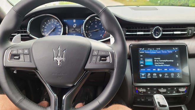 The 2020 Maserati Quattroporte S Q4 offers the latest steering wheel gadgetry, including adaptive cruise control and big shift paddles when in manual mode.