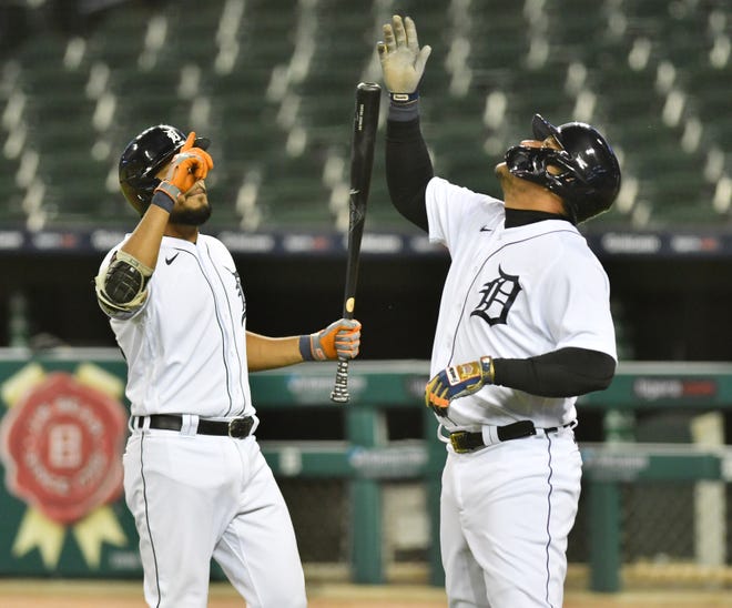 From left, Tigers ' Jeimer Candelario and Miguel Cabrera react after Cabrera ' s solo home run in the third inning.