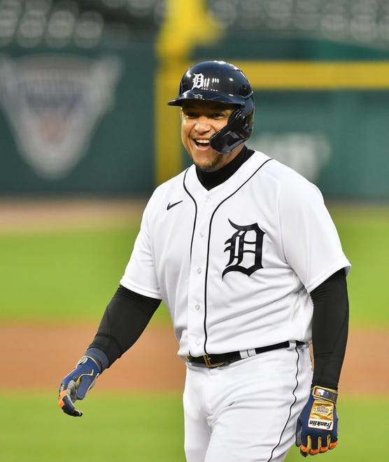 Tigers designated hitter Miguel Cabrera smiles at first base after drawing a walk in the first inning.