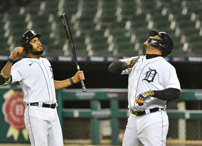 From left, Tigers ' Jeimer Candelario and Miguel Cabrera react after Cabrera ' s solo home run in the third inning.