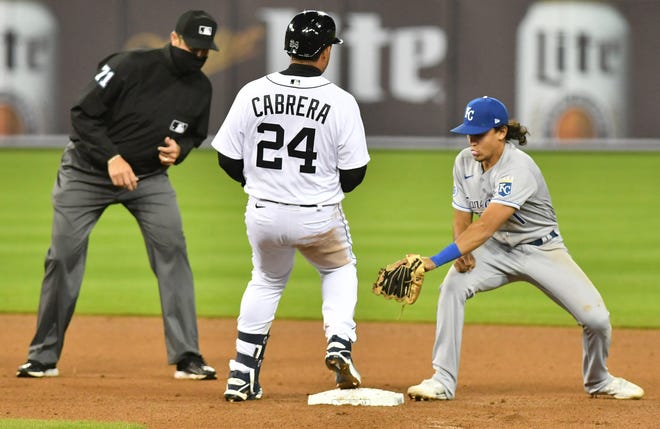 Tigers designated hitter Miguel Cabrera (24) beats the tag by Royals second baseman Adalberto Mondesi on his double in the sixth inning.