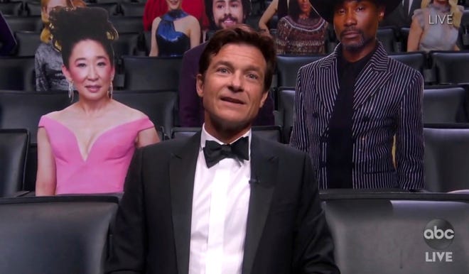 In this video grab captured on Sept. 20, 2020, courtesy of the Academy of Television Arts & Sciences and ABC Entertainment, Jason Bateman appears in the audience surrounded by cardboard cutouts during the 72nd Emmy Awards broadcast.