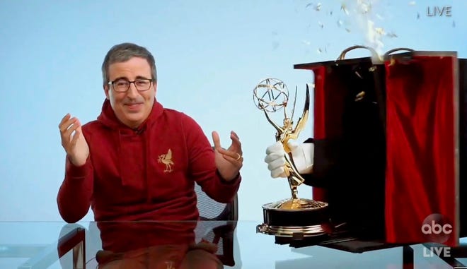 In this video grab captured on Sept. 20, 2020, courtesy of the Academy of Television Arts & Sciences and ABC Entertainment, John Oliver accepts the award for outstanding variety talk series for "Last Week Tonight with John Oliver" during the 72nd Emmy Awards broadcast.