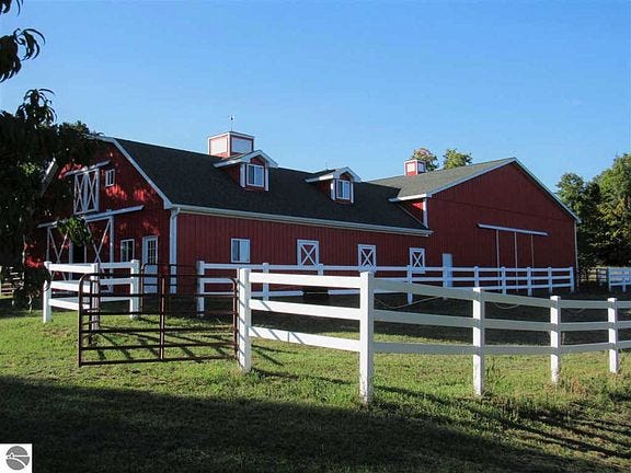 The horse arena also features two automatic horse waterers, a foaling stall with a separate paddock, and an electric fence.