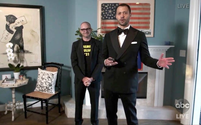 In this video grab captured on Sept. 20, 2020, courtesy of the Academy of Television Arts & Sciences and ABC Entertainment, Damon Lindelof, left, and Cord Jefferson accept the award for outstanding writing for a limited series, movie or dramatic special for "Watchmen" for "This Extraordinary Being" during the 72nd Emmy Awards broadcast.