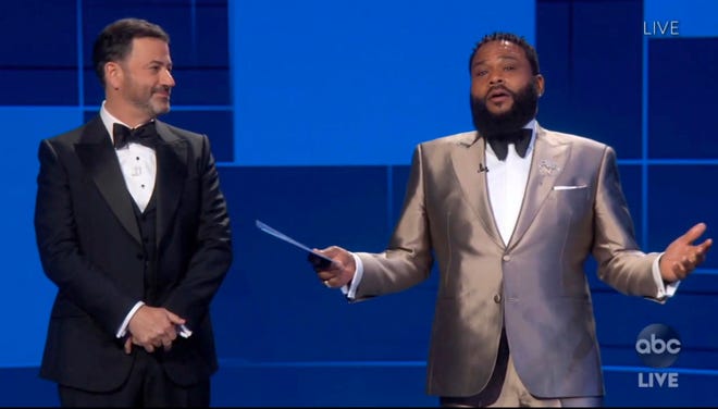 In this video grab captured on Sept. 20, 2020, courtesy of the Academy of Television Arts & Sciences and ABC Entertainment, Jimmy Kimmel, left, and Anthony Anderson speak on stage during the 72nd Emmy Awards broadcast.