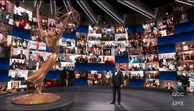 In this video grab captured on Sept. 20, 2020, courtesy of the Academy of Television Arts & Sciences and ABC Entertainment, host Jimmy Kimmel appears with a screen filled with nominees during the 72nd Emmy Awards broadcast.