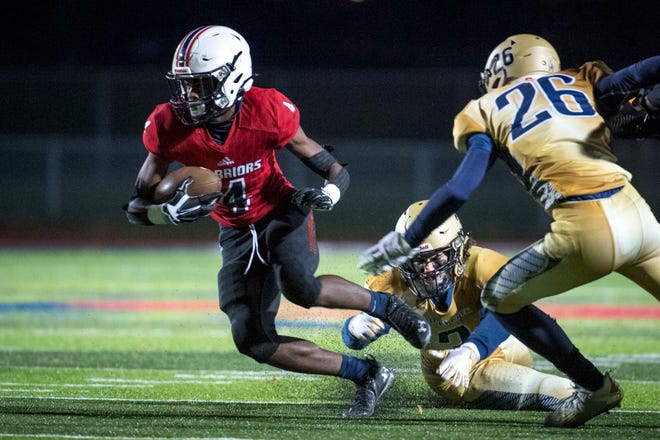 Southfield A&T High School's senior wide receiver Darnell Adams (4) runs the ball during the second quarter against  Rochester Hills Stoney Creek on Oct. 16, 2020.