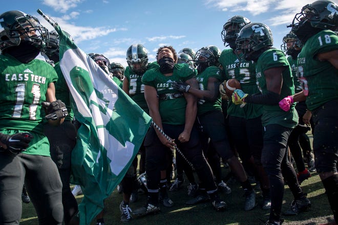 Cass Tech players celebrate their win against Detroit King after the Detroit PSL Championship football game at Detroit Northwestern High School in Detroit, Mich on Oct. 17, 2020.