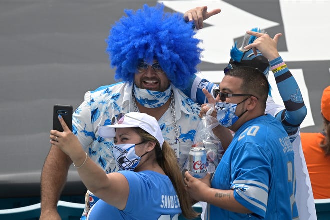Lions fans pose for a photo before the first half.