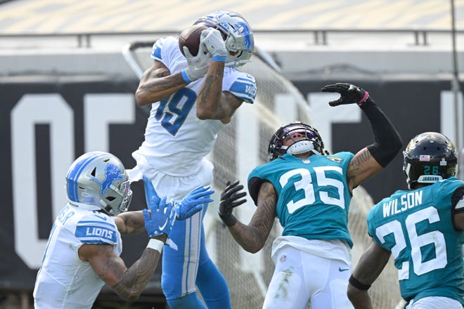Lions wide receiver Kenny Golladay (19) makes a reception in front of Jaguars cornerback Sidney Jones (35) during the second half.