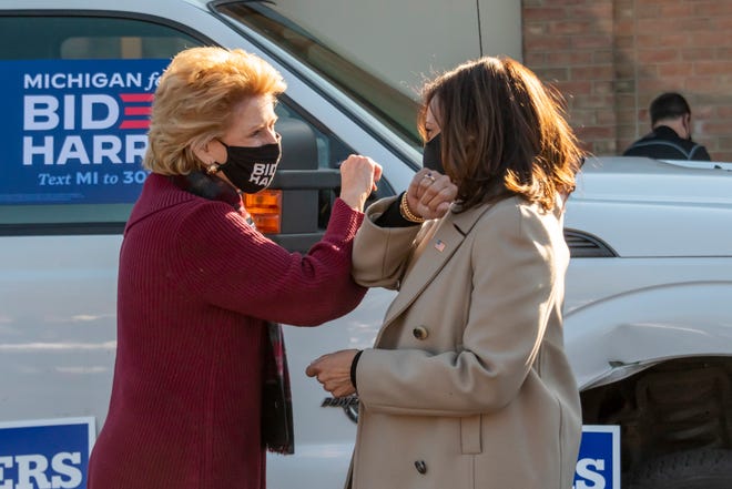 Democratic vice presidential candidate Sen. Kamala Harris (D-Calif), right, greets Sen. Debbie Stabenow as she speaks with supporters at Sheet Metal Workers Local 80 in Southfield while visiting Michigan on Election Day, November 3, 2020.