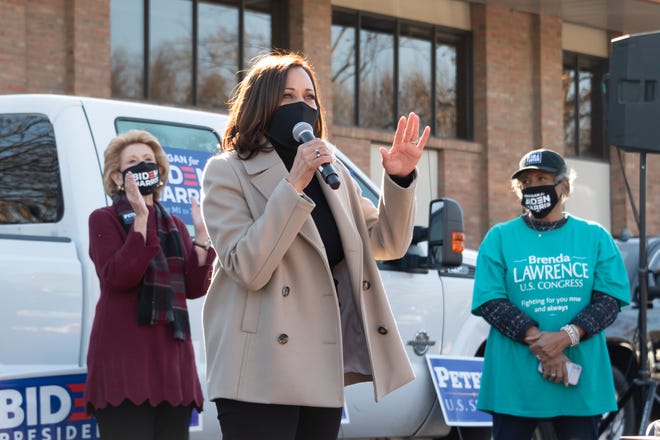 Democratic vice presidential candidate Sen. Kamala Harris (D-Calif), center, stands with Sen. Debbie Stabenow, left, and U.S. Representative Brenda Lawrence  as she speaks with supporters at Sheet Metal Workers Local 80 in Southfield while visiting Michigan on Election Day, November 3, 2020.