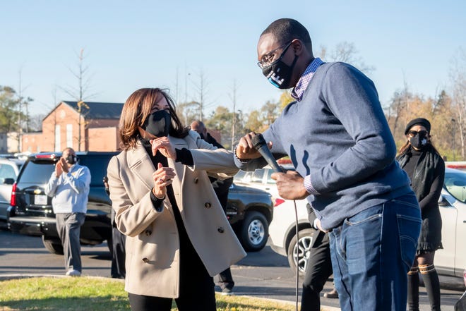 Democratic vice presidential candidate Sen. Kamala Harris (D-Calif), left, greets Michigan Lt. Governor Garlin Gilchrist at Greater Grace Temple, in Detroit while visiting Michigan on Election Day, November 3, 2020.