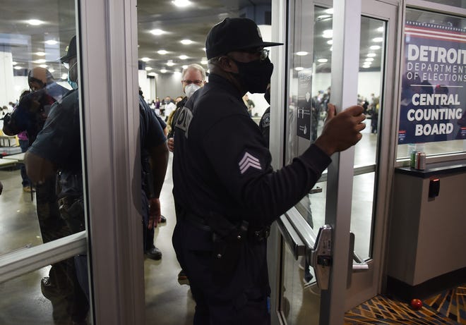 Detroit Police officers prevent MIGOP election challengers from entering the Central Counting Board hall at TCF Center in Detroit on November 4, 2020, one day after Election Day.