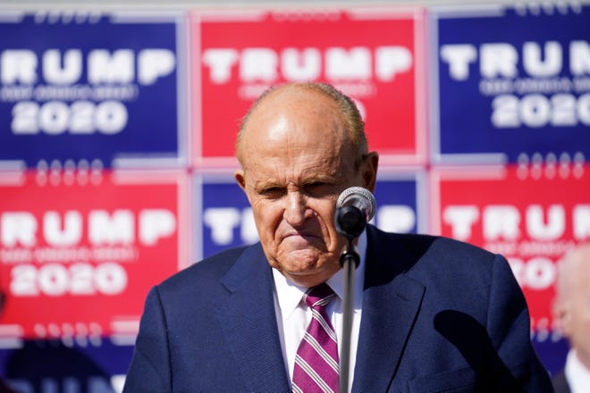 Former New York mayor Rudy Giuliani, a lawyer for President Donald Trump, pauses as he speaks during a news conference on legal challenges to vote counting in Pennsylvania, Saturday Nov. 7, 2020, in Philadelphia.
