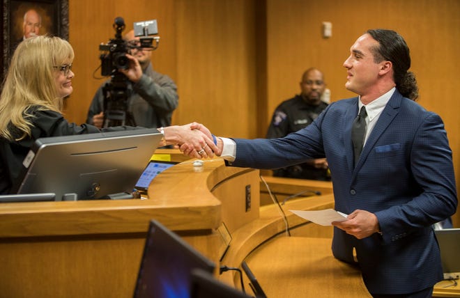 Greg Kelley shakes hand with Judge Donna King after he was formally exonerated Nov. 27, 2019.