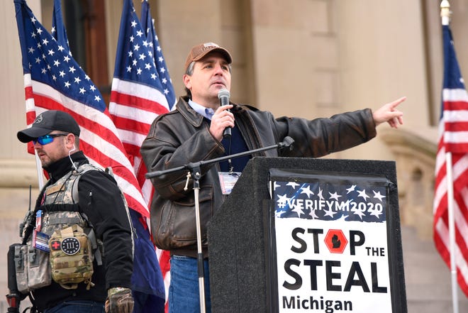 Former state senator Patrick Colbeck speaks on the steps of the Capitol as President Donald Trump supporters gather at the state Capitol Building  in Lansing for a "Stop the Steal" rally disputing the presidential voting Saturday, October 14, 2020.