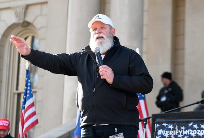 Radio personality Randy Bishop "Trucker Randy"  speaks to the crowd as President Donald  Trump supporters gather at the state Capitol Building  in Lansing for a "Stop the Steal" rally disputing the presidential voting Saturday, October 14, 2020.