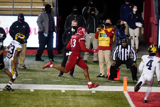 Rutgers' Jovani Haskins (13) scores a touchdown during the second overtime.