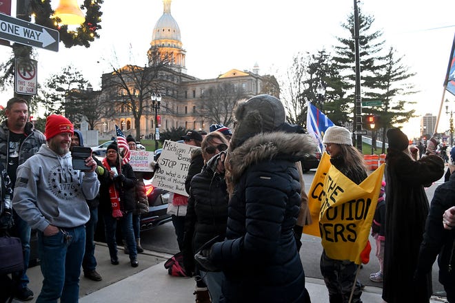 Hundreds of Rudy Giuliani fans wait outside the House Office Building before the House Oversight Committee met in Lansing on  Dec. 2, 2020.