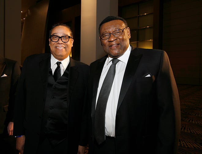 Former Detroit Police Chiefs Benny Napoleon and Ike McKinnon look at historical police items during the Detroit Police Department's 150th anniversary in the 'Blue & Silver Ball' gala at Cobo Center in Detroit, Mich. Friday, Feb. 27, 2015.