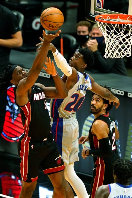 Miami Heat forward Precious Achiuwa (5) drives to the basket as Detroit Pistons guard Josh Jackson (20) attempts to block the shot during the first half.