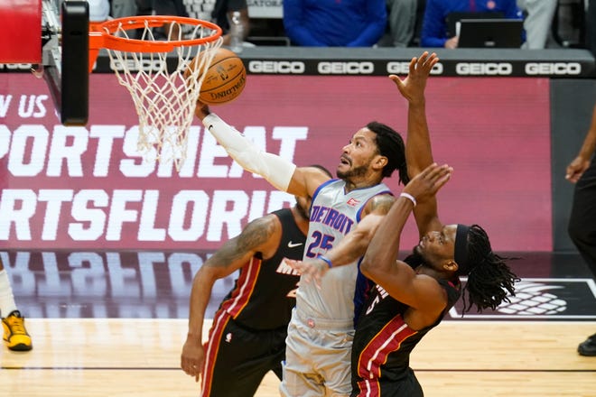 Detroit Pistons guard Derrick Rose (25) drives to the basket as Miami Heat forward Precious Achiuwa (5) defends during the first half.