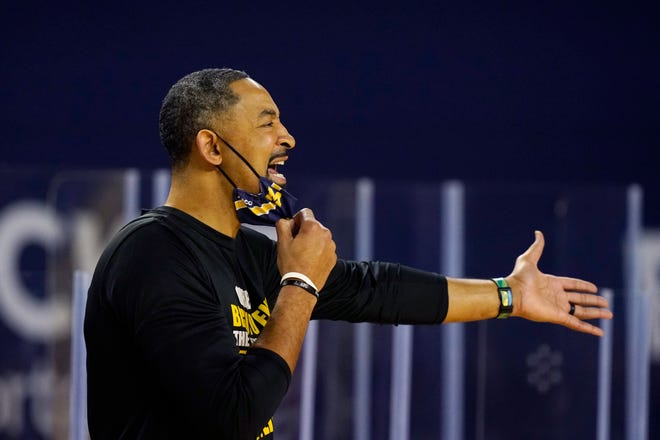 Michigan head coach Juwan Howard yells from the sideline during the first half.