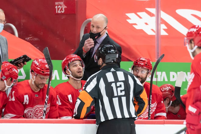 Detroit head coach Jeff Blashill talks to referee Justin St. Pierre while challenging a goal in the third period. Detroit lost the challenge and was penalized two minutes.