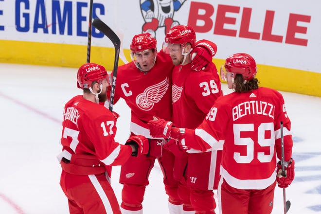 (From left) Detroit defenseman Filip Hronek, center Dylan Larkin, right wing Anthony Mantha, and left wing Tyler Bertuzzi celebrate a goal by Mantha in the second period.