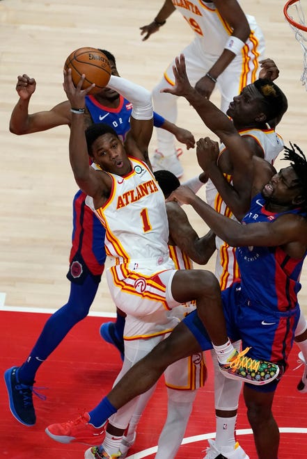 Atlanta Hawks forward Nathan Knight (1) drives into Detroit Pistons center Isaiah Stewart, right front, during the first half of an NBA basketball game Wednesday, Jan. 20, 2021, in Atlanta.